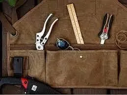 Ironwood Tool Co. 16oz Waxed Canvas Garden Tool Apron with shoulder pads, double stitched pocket, metal grommets for strap
