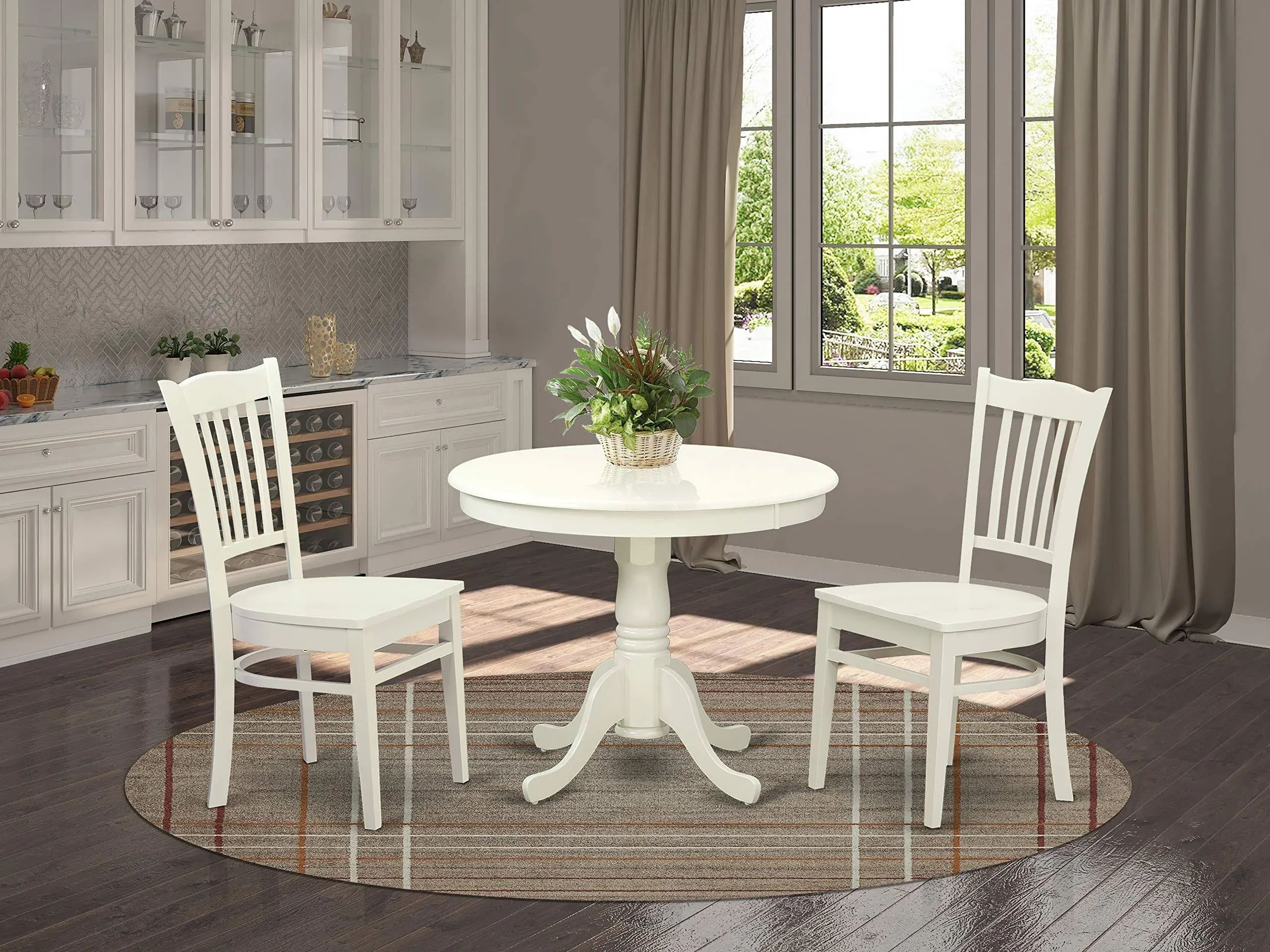 East West Furniture Antique 3 Piece Kitchen Set Contains a Round Dining Room Table with Pedestal and 2 Solid Wood Seat Chairs, Linen White