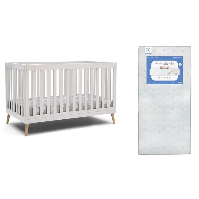 Delta Children Essex 4-in-1 Convertible Baby Crib, Bianca White with Natural Legs + Delta Children Twinkle Galaxy Dual Sided Recycled Fiber Core Crib and Toddler Mattress (Bundle)