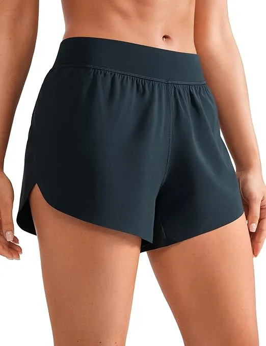 CRZ YOGA Mid Waisted Dolphin Athletic Shorts for Women 4" Lightweight High Split Gym Workout Shorts with Liner Quick Dry